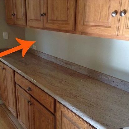 an empty kitchen with wood cabinets and granite counter tops in the process of remodeling