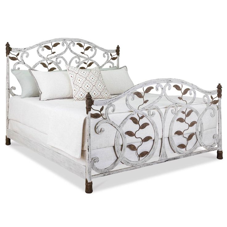 a bed with white linens and pillows on it's headboard, in front of a white background