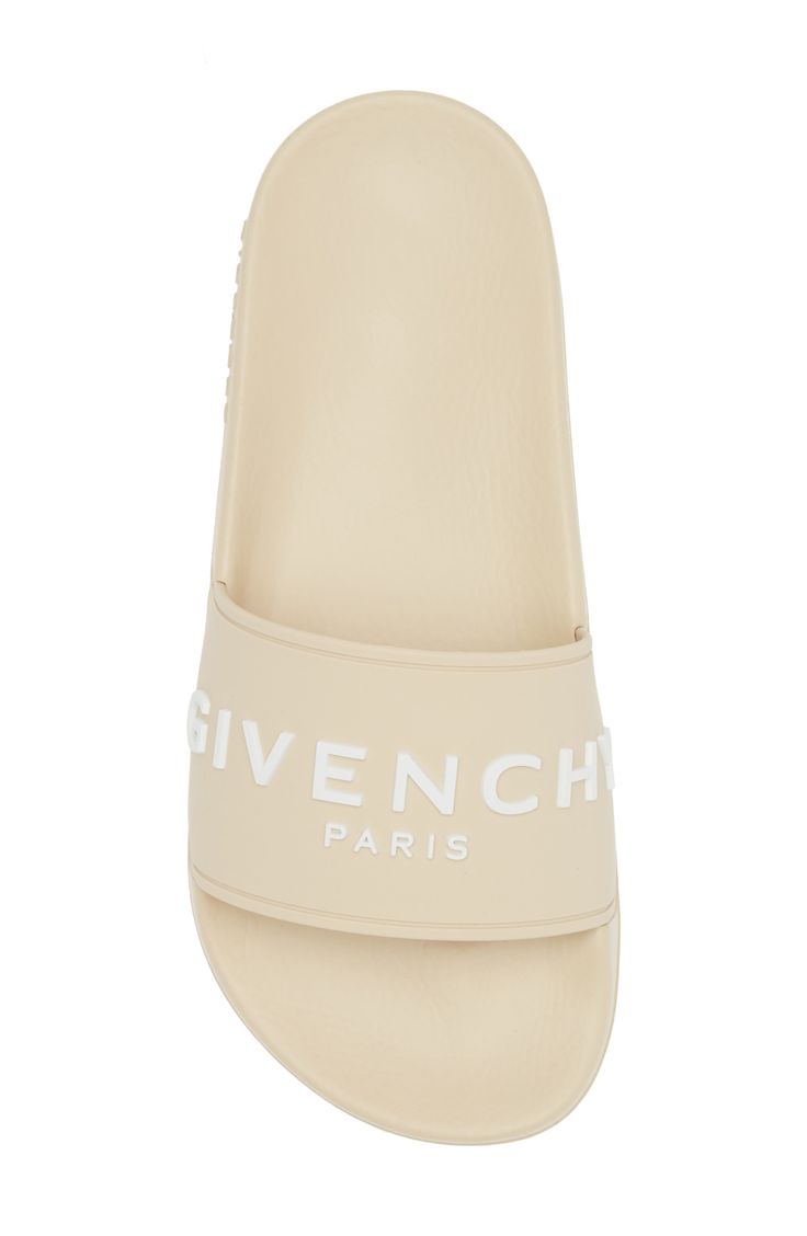 A bold Givenchy logo stamp crosses the wide strap of cushy, water-friendly sliders. Synthetic upper, lining and sole Made in Italy Women's Designer Shoes Luxury Spring Slides, Casual Open Toe Slides With Logo Print, Logo Open Toe Sandals For Summer, Luxury Summer Sandals With Logo, Designer Beach Slides With Cushioned Footbed, Designer Slides With Branded Insole For Beach, Designer Beach Slides With Branded Insole, Summer Slide Sandals With Logo Print, Summer Slide Sandals With Logo