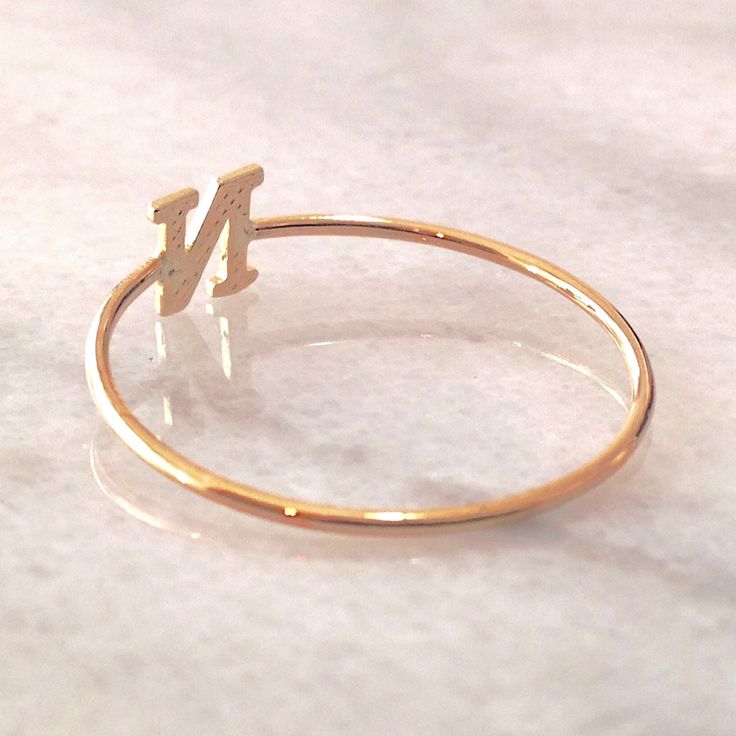 This unique initial letter cut-out is composed of 14K solid gold and beautifully complemented by a durable 14K solid gold band. Initial Letter Dimensions: approximately 5mm (w) x 5mm (h) Band Thickness: approximately 1.25mm Metal Finish: High Shine Polish This design is available in Rose, White and Yellow 14K Gold This item is proudly made in USA and also available in 18K solid gold options upon request. Kindly email info@nanabijoujewelry.com for further assistance with pricing and details. Plea Personalized Initial Ring In White Gold, Personalized Initial Ring In Yellow Gold, 14k Gold Stackable Rings With Initials, Minimalist Initial Rose Gold Ring, Personalized 14k White Gold Initial Ring, Personalized 14k Gold Rings With Initials, White Gold Monogram Ring In 14k, White Gold 14k Monogram Ring, Classic 14k Gold Initial Ring For Personalized Gift