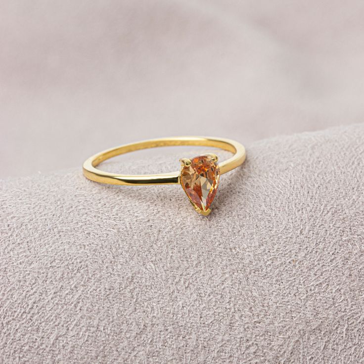 Citrine stone will envelop one's soul with joy and happiness. It is believed that citrine stone, which helps to reduce intense stress and get rid of tension, attracts abundance. While shaping our ring, we were impressed by the beauty of the rain and gave it a drop shape. This drop-shaped citrine ring will give you happiness. It is stylish and suitable for daily use. We are sure that our ring will add style to your style. The birthstone for those born in November is Citrine. Our necklace compatib Citrine Birthstone Ring For Gift, Citrine Birthstone Crystal Ring Gift, Citrine Gemstone Birthstone Ring As Gift, Yellow Gold Citrine Birthstone Ring For Gift, Citrine Teardrop Wedding Ring, Yellow Gold Citrine Birthstone Ring As Gift, Dainty Gold Topaz Ring As Gift, Fine Jewelry Teardrop Crystal Ring As Gift, Yellow Gold Citrine Crystal Ring Gift