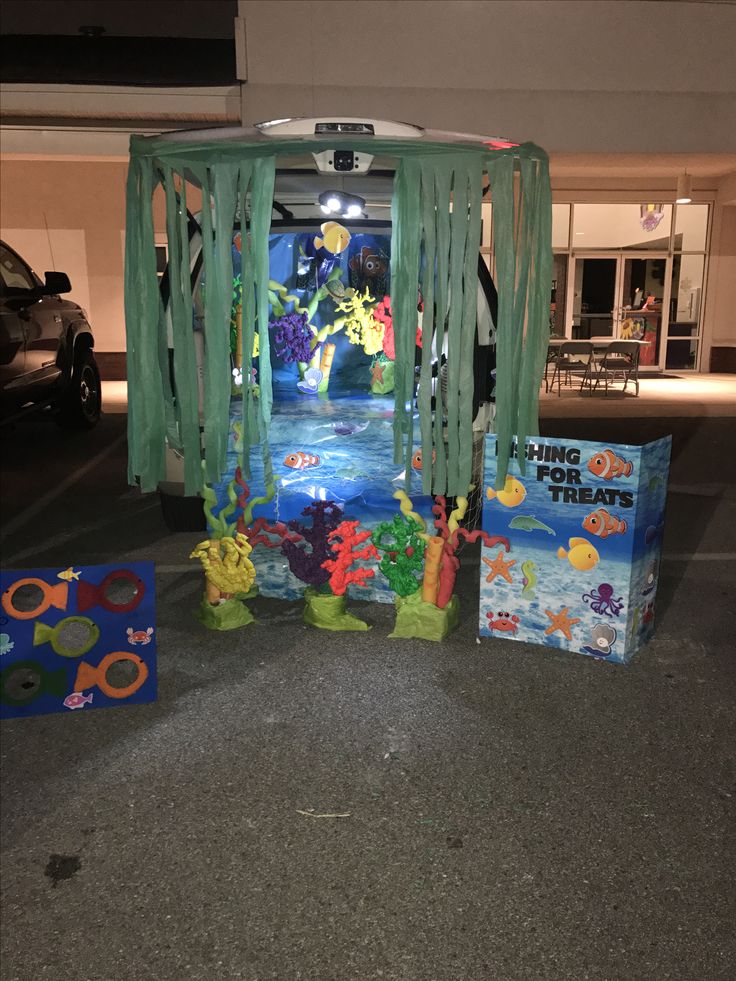 the entrance to an aquarium themed parking lot