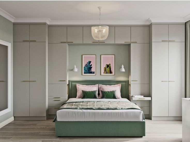 a bedroom with a bed, dressers and two pictures on the wall above it