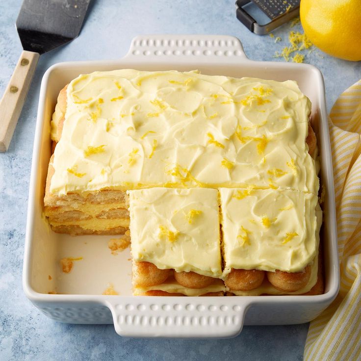 a cake in a pan with lemons on the side