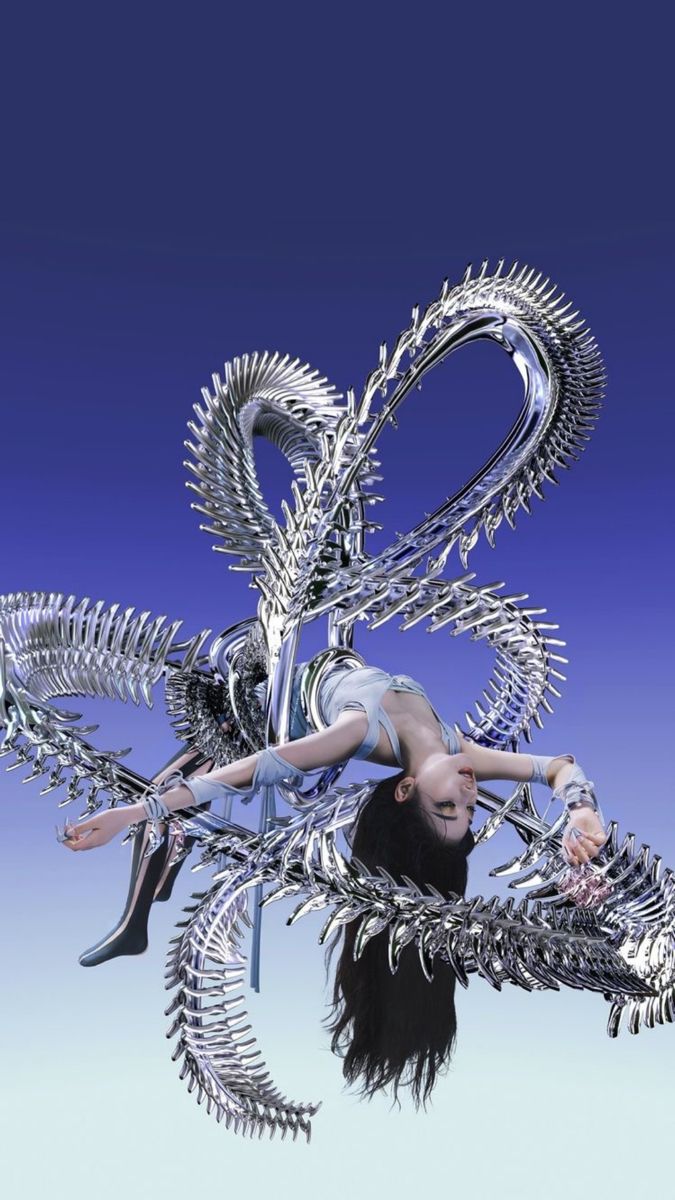 a woman with long black hair standing in front of a metal sculpture