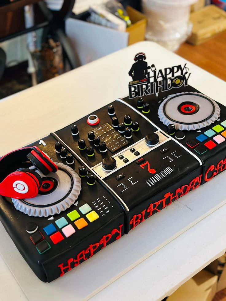 a birthday cake made to look like a dj controller