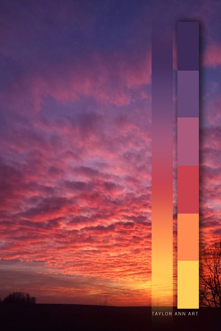 the sun is setting behind a tall building with two vertical lines in front of it