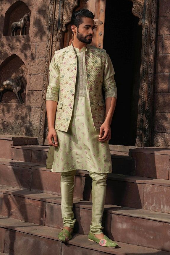 Mint green kurta with all over floral prints. Paired with a quilted bundi with floral prints and a churidar. - Aza Fashions Festive Green Nehru Jacket For Festivals, Designer Green Nehru Jacket With Zari Work, Green Nehru Jacket With Zari Work For Designer Wear, Spring Designer Traditional Wear In Pista Green, Festive Green Kurta For Spring, Green Kurta With Zari Work For Spring, Green Nehru Jacket With Zari Work For Festivals, Traditional Pista Green Kurta For Spring, Spring Green Kurta With Zari Work