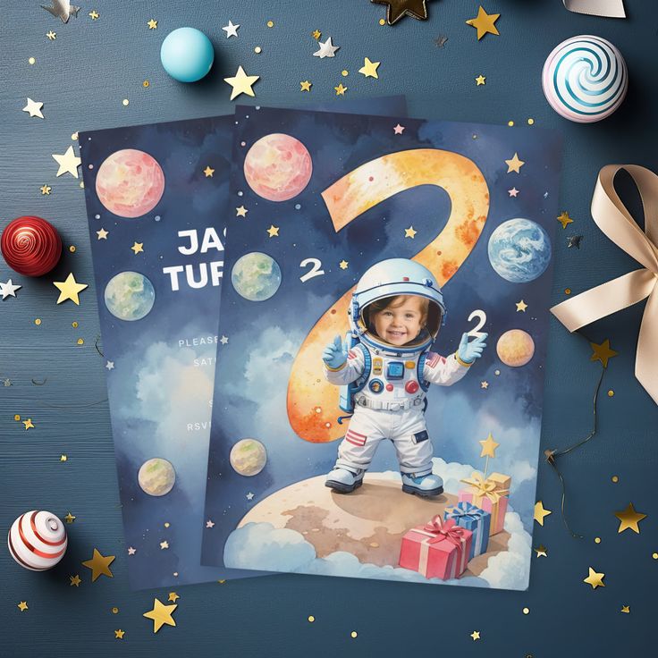 a birthday card with an astronaut on the number two and stars around it, surrounded by other holiday decorations