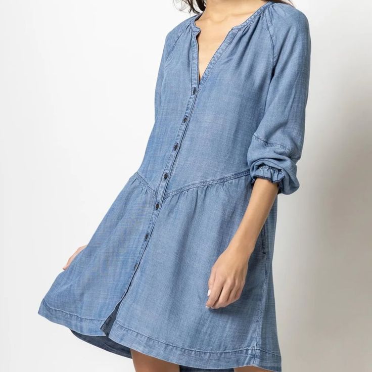 This Sweet Chambray Dress Is A Medium Weight, Incredibly Soft Fabric With Beautiful Drape. Never Worn With Beautiful Seam Details And Is The Perfect Dress For In-Between Season Weather! New W/O Tags 100% Lyocell Length Approx 35" (Size Small) Flowy Brunch Dress With Button Closure, Blue Button-up Brunch Dress, Blue Button-up Dress For Brunch, Denim V-neck Dress With Button Closure, Flowy Buttoned Dress For Brunch, Flowy Blue Buttoned Dresses, Blue Flowy Button Dress, Flowy Dresses With Buttons For Brunch, Flowy Blue Dress With Buttons