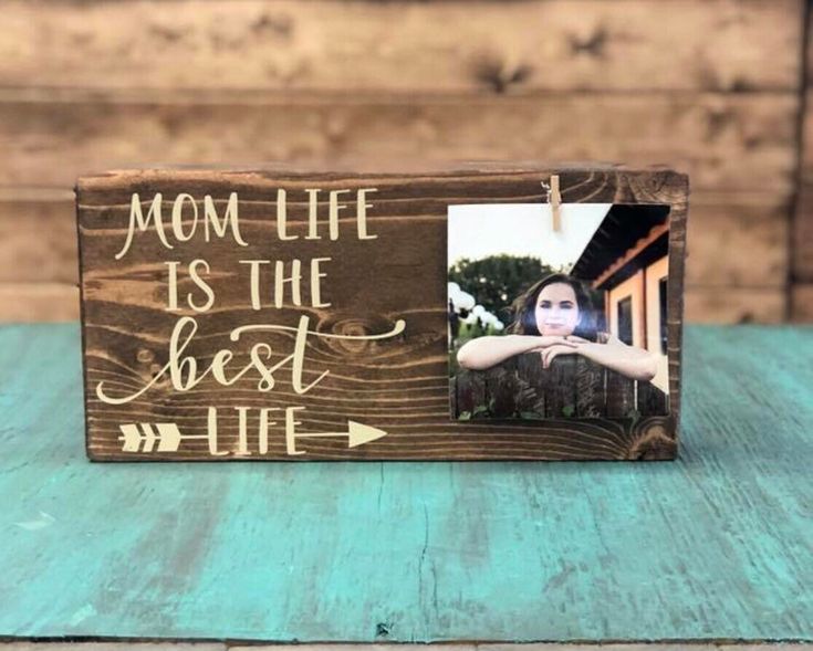 a wooden frame with the words mom life is the best life