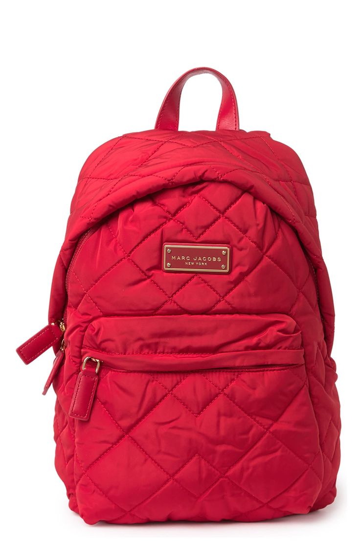 Quilted construction adds a luxe feel to this nylon backpack. Single top handle. Adjustable shoulder straps. Two-way zip top closure. Exterior features 1 zip pocket. Interior features 1 zip pocket. Perfect for school backpack or bookbag. Approx. 14" H x 14" W x 7" D. Approx. 3" handle drop, 6-12" strap drop. Imported Marc Jacob Backpack, Rucksack Bag, Quilted Backpack, Backpack Brands, Marc Jacobs Bag, Pink Backpack, Jansport Backpack, School Backpack, Diaper Backpack