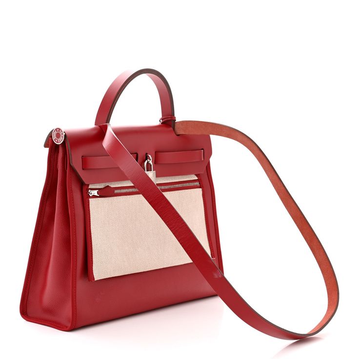 This is an authentic HERMES Toile H Berline Vache Hunter Herbag Zip PM 31 in Rouge Piment and Ecru. This tote is crafted of coated canvas in red. The shoulder bag features a rear canvas hanging zipper pocket, a red vache leather top crest, a leather top handle, a shoulder strap, and a strap closure with polished palladium hardware. This opens to a canvas interior with a matching canvas removable pouch. Hanging Canvas, Leather Top, Top Handle, Zipper Pocket, Shoulder Strap, Pouch, Shoulder Bag, Zipper, Canvas