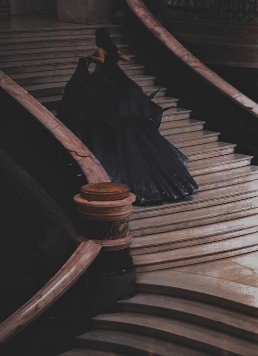 an umbrella sitting on top of a wooden staircase