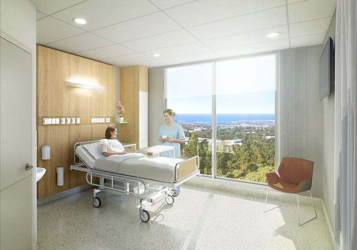 a hospital room with two people in it