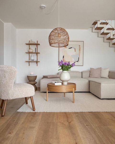 a living room filled with furniture and a stair case