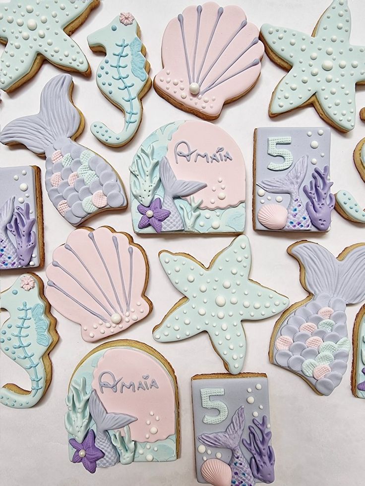 decorated cookies are arranged in the shape of sea animals