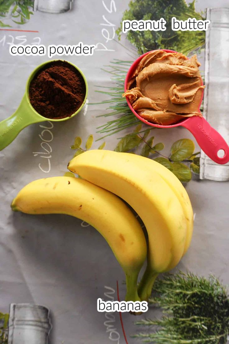 bananas, cocoa powder and butter on a table