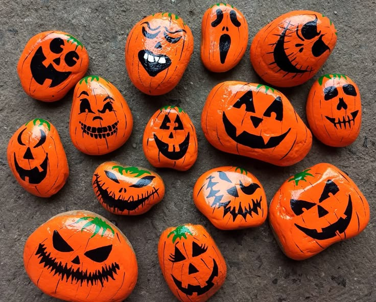 pumpkins painted to look like jack o lantern faces