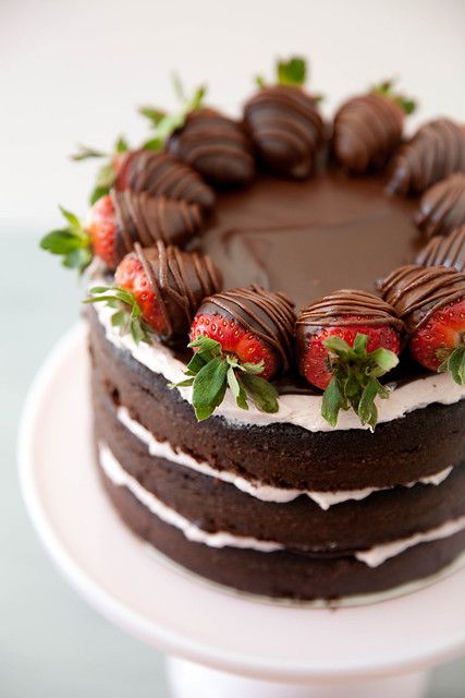 a chocolate cake with strawberries on top