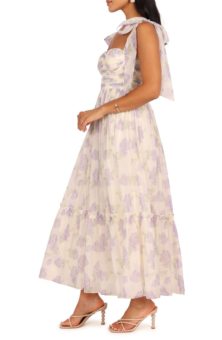 Get your garden-party season RSVPs out; you've found the perfect dress to make you the belle of the blooms. Exposed back-zip closure Sweetheart neck Adjustable tie straps Lined 100% polyester Hand wash, dry flat Imported Garden Dress Party, Bow Tie Strap Dress, Floral Lavender Dress, Purple Summer Dresses For Garden Party, Purple Dresses For Summer Garden Party, Summer Purple Maxi Dress With Fitted Bodice, Summer Maxi Dress With Fitted Bodice In Purple, Purple Maxi Dress With Fitted Bodice For Summer, Purple Floral Dress For Spring Garden Party