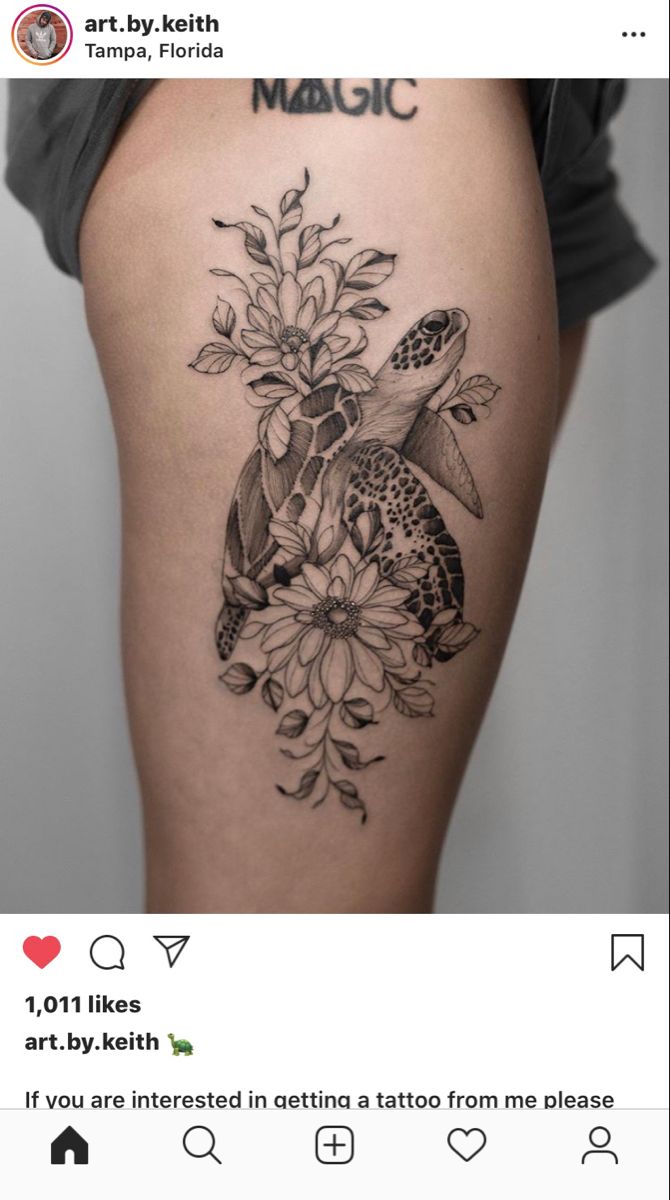 a turtle and flowers tattoo on the thigh