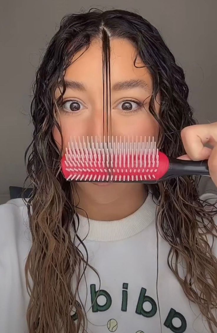 What it is: A styling hairbrush ideal for using on wet hair to help create perfectly defined curls.Who it's for: Ideal for medium-length wavy or curly hair.What it does: This styling brush creates tension in wet hair, like scissors through ribbon, to help create perfectly defined curls. It can also be used for detangling wet hair and blow-drying dry hair. The seven rows of bristles can be individually removed to customize the brush based on your hair density. 8.35" x 1.65" x 1.54" Plastic Made i Hairbrush Cleaning, Curl Brush, Wavy Or Curly Hair, Denman Brush, Wavy Hair Care, Clean Hairbrush, Defined Curls, Styling Brush, Hair Density