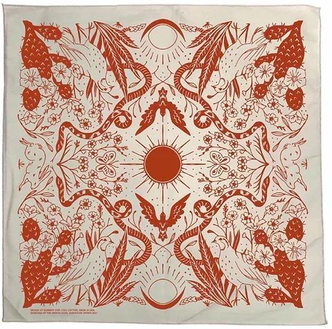 a red and white bandanna with birds on it