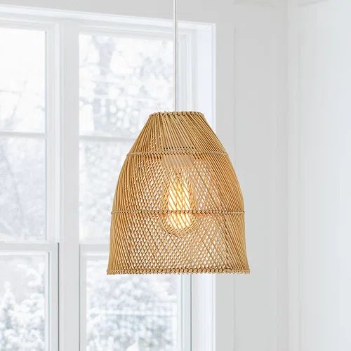 a bamboo light hanging from a ceiling in a room with white walls and flooring