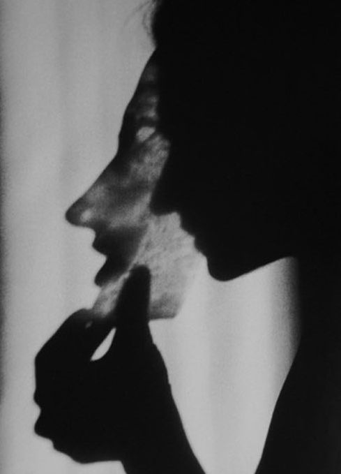 black and white photograph of a woman's face in profile