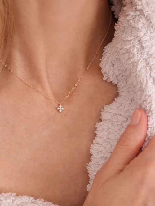 Introducing our first enewton couture piece, 14kt Gold and Diamond Signature Cross Necklace. Natural Diamonds Carat Weight: 0.10CT per piece (.02CT per diamond) Color: GH Clarity: SI1-2 Cut: Round 14kt gold chain that can be worn at 16", 17" or 18" Sourcing: our diamonds are conflict-free and adhere to the Kimberly Process Spring ring clasp Made by Enewton Due to the nature of diamonds, we do not recommend wearing your diamond jewelry while swimming or showering, as residue can build up on your Small Diamond Cross Necklace, Bd Gift, Dainty Cross Necklace, Tiny Cross Necklace, Diamond Cross Necklace, Gold Circle Necklace, Cross Earrings Studs, Signature Necklace, Gold Cross Necklace