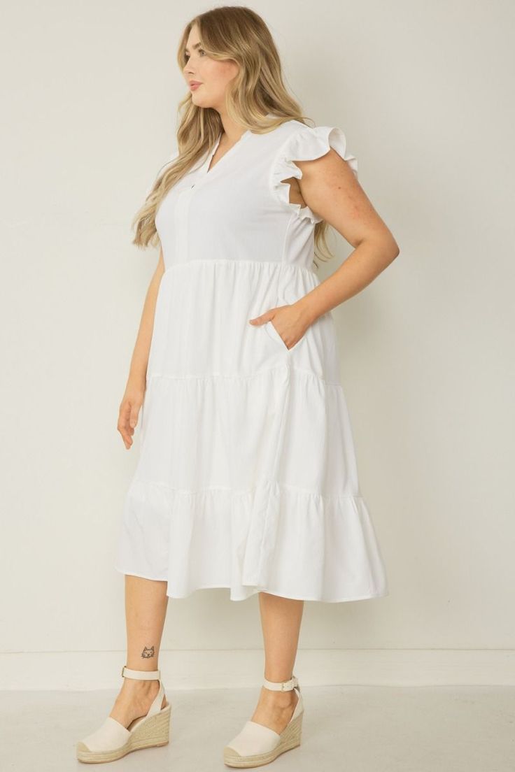 This Ruffled Pocket Tiered Midi Dress is perfect for any occasion! It's lightweight, has fun sleeves that are ruffled to perfection, and can easily be switched from casual to dressy. Forget a closet full of options-- this dress has you covered! This dress features a v-neck, placket, ruffled cap sleeves, pockets, is lined and has a tiered flowy midi silhouette. It's the perfect additional to your wardrobe. Small Bust 38" Length 44" : Medium Bust 40" Length 44" Large Bust 42" Length 44" : XL Bust Cotton Midi Dress With Ruffle Sleeves, Midi-length Ruffle Dress With Ruffle Hem For Day Out, Casual Midi Dress With Ruffle Sleeve For Spring, Casual Tiered Ruffle Midi Dress, Casual Tiered Midi Dress With Ruffles, Casual Ruffle Dress With Ruffle Hem And Sleeves, Casual Midi Length Tiered Ruffle Dress, Casual Midi Dress With Ruffle Sleeves For Brunch, White Midi Tiered Dress With Ruffle Hem