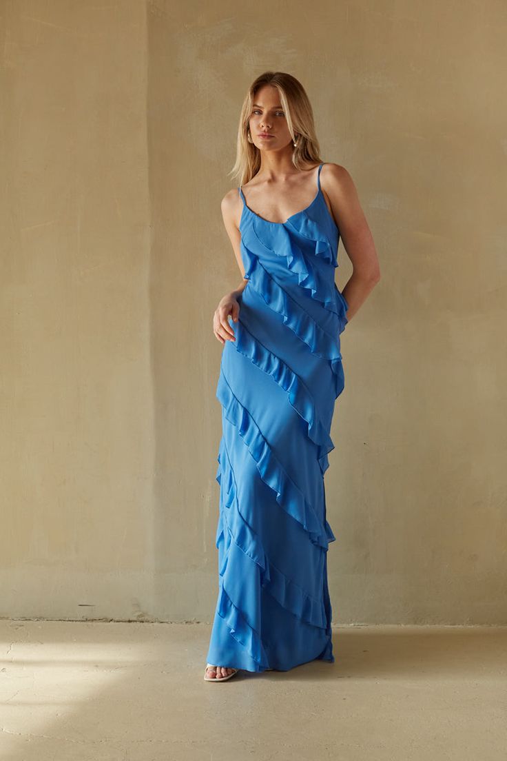 This Item is excluded from promotions. Embrace your femininity in the Elizabeth Tiered Ruffle Maxi Dress! This stunning dress features a V-neckline, asymmetrical tiered ruffles, adjustable spaghetti straps, and a side leg slit. Available in white, blue, and dusty rose. Pair with a simple heel to complete the look! Details 100% Polyester Fully lined Hidden back zipper with clasp closure Hand wash cold / Dry flat Hot Wedding, White Dresses Graduation, Mini Prom Dresses, Dream Future, American Threads, Short Prom Dresses, Banquet Dresses, Ruffle Maxi Dress, Pretty Princess