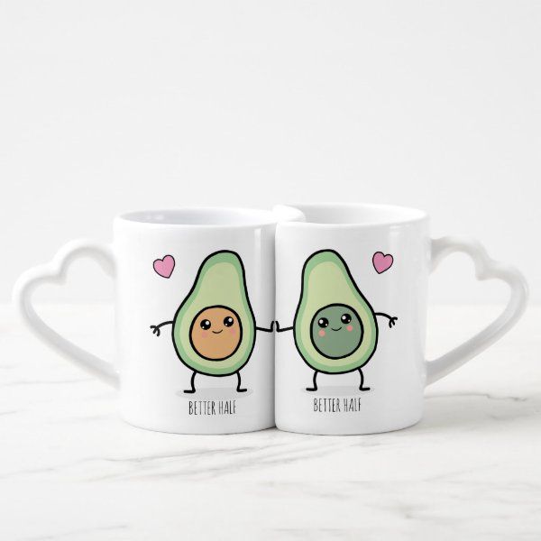 two coffee mugs with an avocado couple holding hands