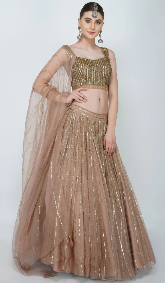 Gold Semi-stitched Hand Embellished Lehenga, Festive Gold Hand Embellished Lehenga, Glamorous Gold Hand Embellished Sharara, Festive Gold Hand-embellished Lehenga, Glamorous Gold Hand-embellished Sharara, Gold Hand Embellished Floor-length Lehenga, Gold Hand Embellished Choli For Party, Gold Hand Embellished Choli For Festive Occasions, Gold Hand Embellished Party Choli