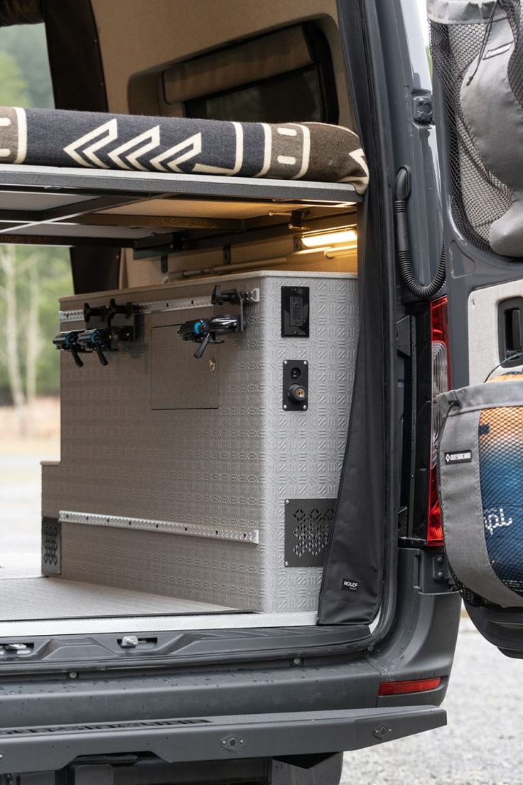 the back end of a van with an open trunk