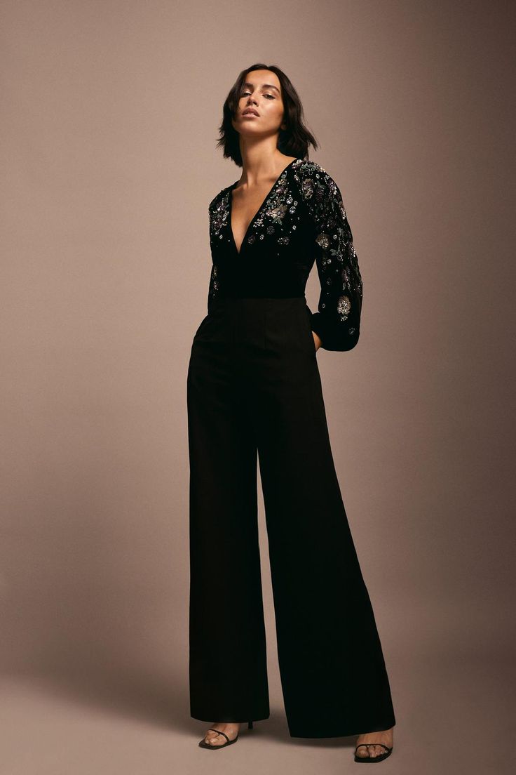 Style: JumpsuitFabric: VelvetLength: RegularNeckline: V NeckSleeve Length: Long Sleeve Prom Jumpsuits Women, Black Tie Black Women, Party Jumpsuits For Women, Jumpsuit Soiree, Diwali Party Outfit, Black Tie Jumpsuit, Party Wear Jumpsuit, Formal Party Outfit, Evening Wear Jumpsuits