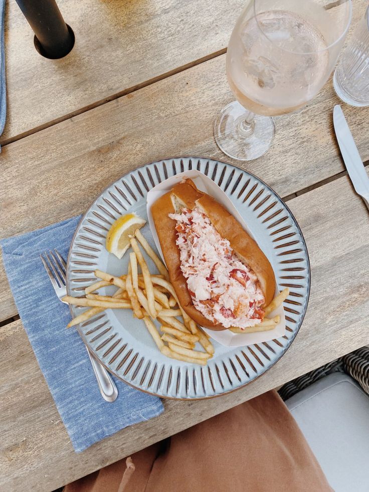 a plate with french fries and lobster on it