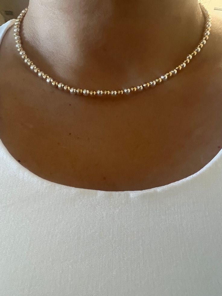 "Gold Plated and 925 Sterling Silver beads. You can use it solo as a choker or put a charm on it. You  can also layer  with other necklaces.  Details: Bead Size: 4 mm 2\" Extension chain to adjust" Dainty Gold Bead Choker Necklace, Dainty Gold Beaded Choker Jewelry, Adjustable Tiny Beads Pearl Necklace, Dainty Adjustable Choker With Spacer Beads, Adjustable Beaded Chain Pearl Choker, Adjustable Minimalist Pearl Necklace With Beaded Chain, Pearl Necklace With Tiny Round Beads, Adjustable Beaded Pearl Choker, Adjustable Beaded Pearl Choker Necklace