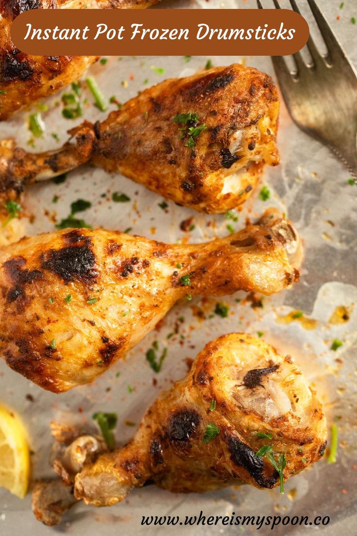 chicken drums with lemon wedges and parsley on the side