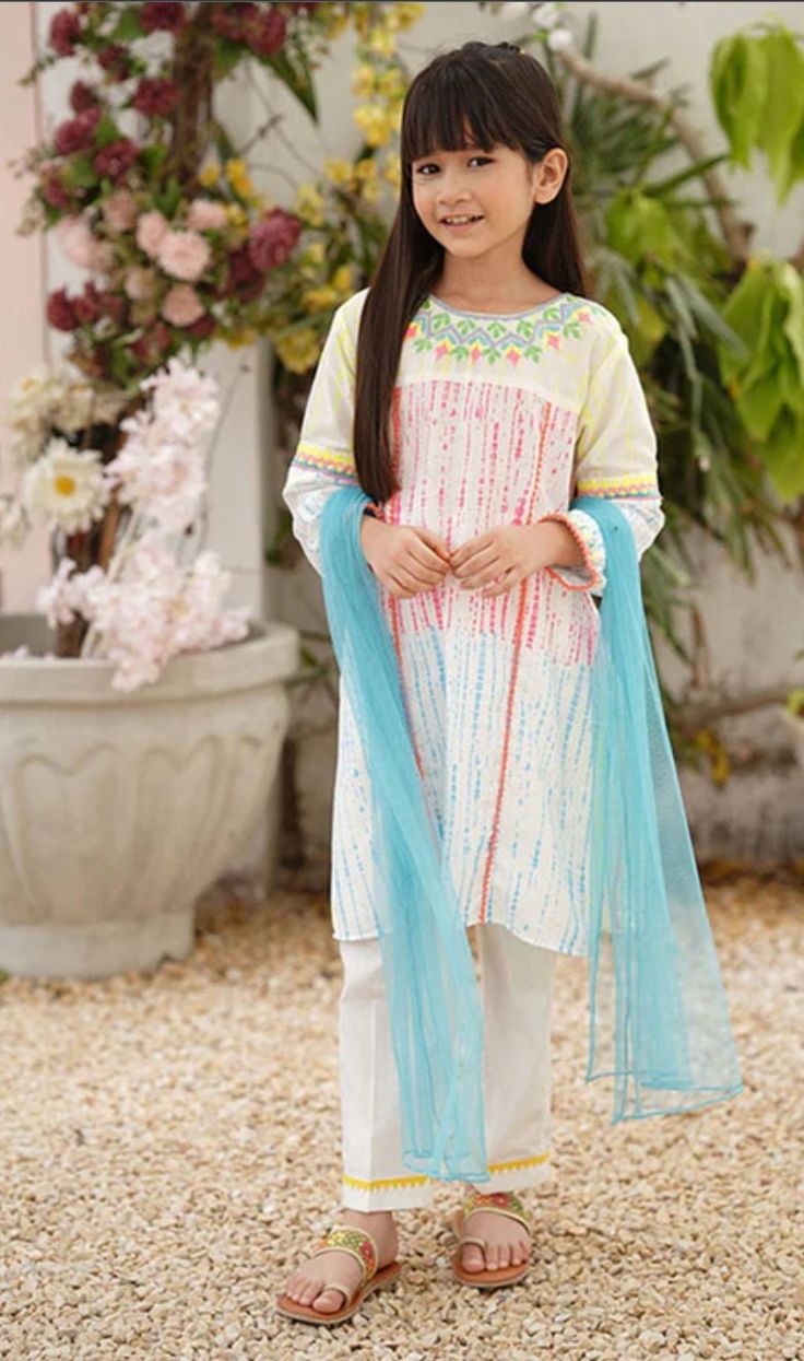 3- Piece Embellished Suit for Girls Description : Kameez (Shirt) : White Cotton Top with Screen Print, Embroidery and Laces. Shalwar (Pants) : White Cotton Pants with Laces Dupatta (Scarf) : Blue Soft Net Dupatta Country of Origin : Pakistan General Care Instruction : Should be washed in gentle cycle and hung to dry. Color may bleed so please be mindful of other items with it. General Disclaimer: Size chart provides reference sizes and actual sizes might be slightly different from the size chart. Actual colors of the outfit may vary from the colors being displayed on the screen Spring Festive Salwar Kameez With Mirror Work, Spring Anarkali Salwar Kameez With Mirror Work, Spring Cotton Salwar Kameez With Mirror Work, Spring Embellished Straight Kurta, White Sets With Mirror Work For Spring, Spring Multicolor Embroidered Straight Kurta Dresses, Embellished Multicolor Kurta For Eid, Pink Spring Dresses With Mirror Work, Pink Spring Dress With Mirror Work