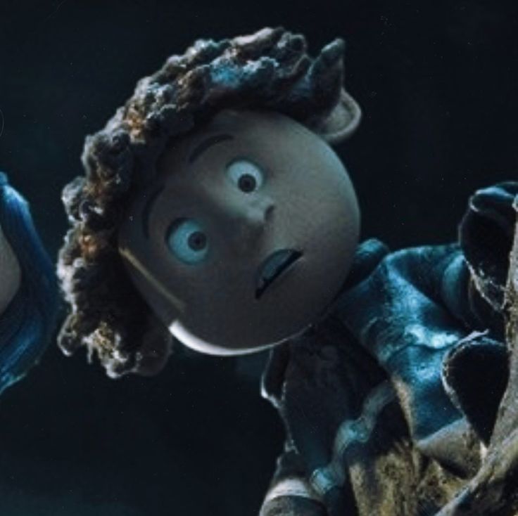 an animated doll with curly hair holding a blue object in his hand and looking up at the sky