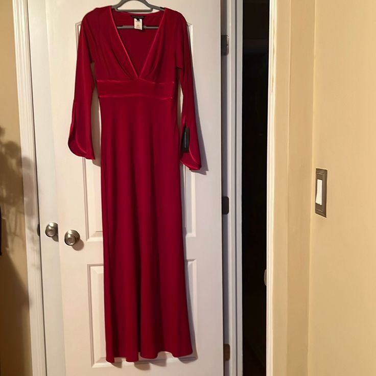 Lady In Red Will Be A Knockout In This Gorgeous Deep Red, Low Cut, Trumpet Sleeves, Gown. Wear To A Wedding, Gala, Special Event. Never Worn, Smoke Free Home, No Tears, Rips Or Stains. Red Long Sleeve Gown For Holidays, Holiday Maxi Dress For Dinner, Holiday Floor-length Maxi Dress For Dinner, Holiday V-neck Maxi Dress For Dinner, Holiday Dinner Floor-length Maxi Dress, Red Full Length Evening Dress, Red Long Sleeve Lined Dress, Red Maxi Length Evening Dress For Holiday, Red Floor-length Evening Dress For Dinner