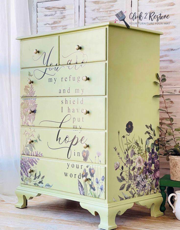 a yellow dresser with flowers painted on it and words written on the drawers that say you are my refuge