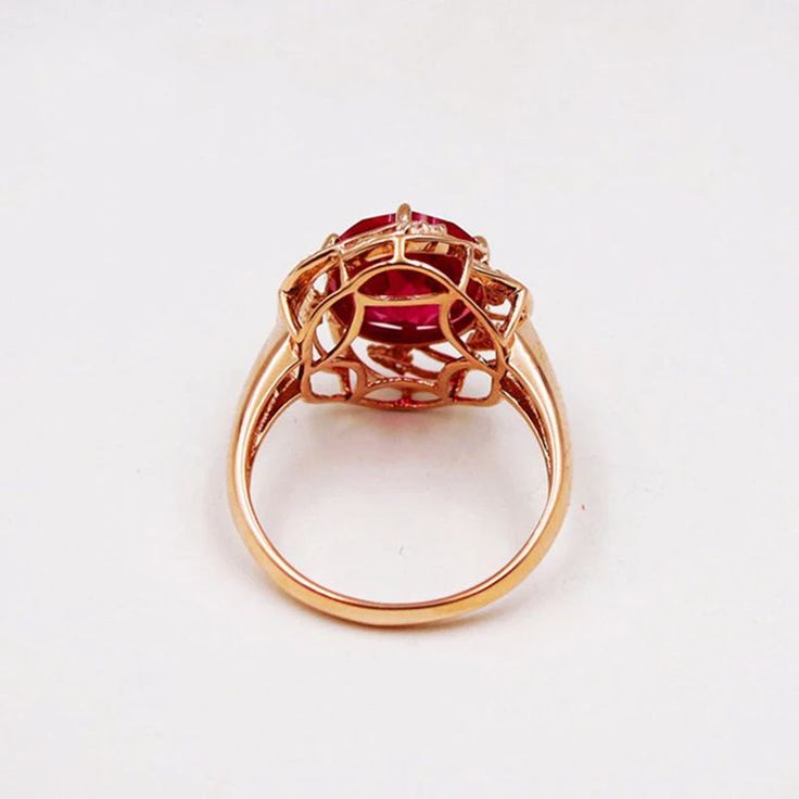 VAIGE Purple 14K Rose Gold Inlaid Flower Ruby Rings Crystal Discover the exquisite beauty of the VAIGE Purple 14K Rose Gold Inlaid Flower Ruby Ring. This stunning piece is designed for those who appreciate elegance and luxury. Key Features: Main Stone: Vibrant Ruby that captivates with its rich color and brilliance Metal Type: Crafted from high-quality 14K Rose Gold for a luxurious feel Setting Type: Tension setting that enhances the stone's brilliance while providing a secure fit Style: A perfe Fine Jewelry Rose Gold Flower Ring With Halo Setting, 14k Rose Gold Ruby Ring With Halo Setting, 14k Rose Gold Oval Ruby Ring, Oval 14k Rose Gold Ruby Ring, Oval Rose Gold Flower Ring In 14k, Rose Gold Flower Ring With Halo Setting, Rose Gold Flower Ring With Gemstone, Rose Gold Gemstone Flower Ring, Formal Rose Gold Flower Ring