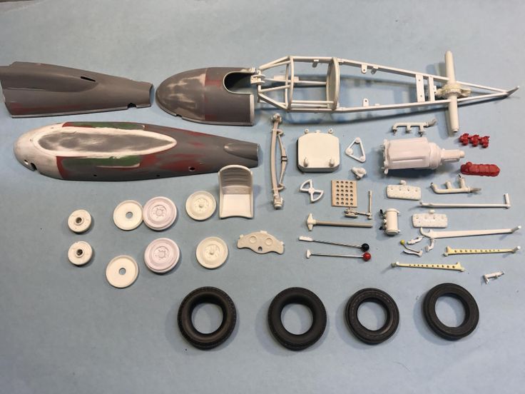 an assortment of parts for a toy airplane