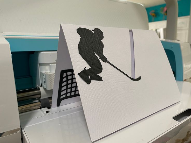 a paper cut out of a hockey player on top of a machine