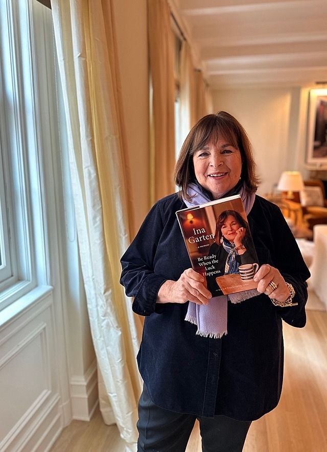 a woman holding a book in her hands