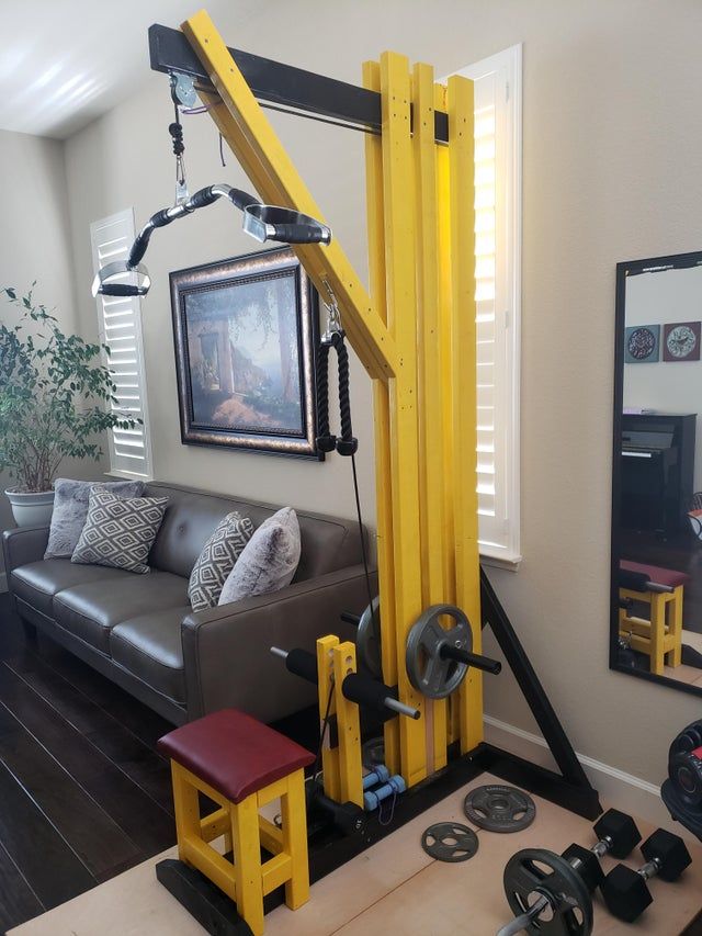 a living room filled with furniture and a gym equipment