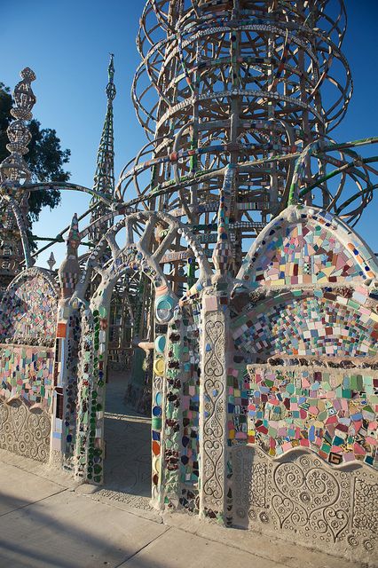 an intricately designed structure on the side of a road